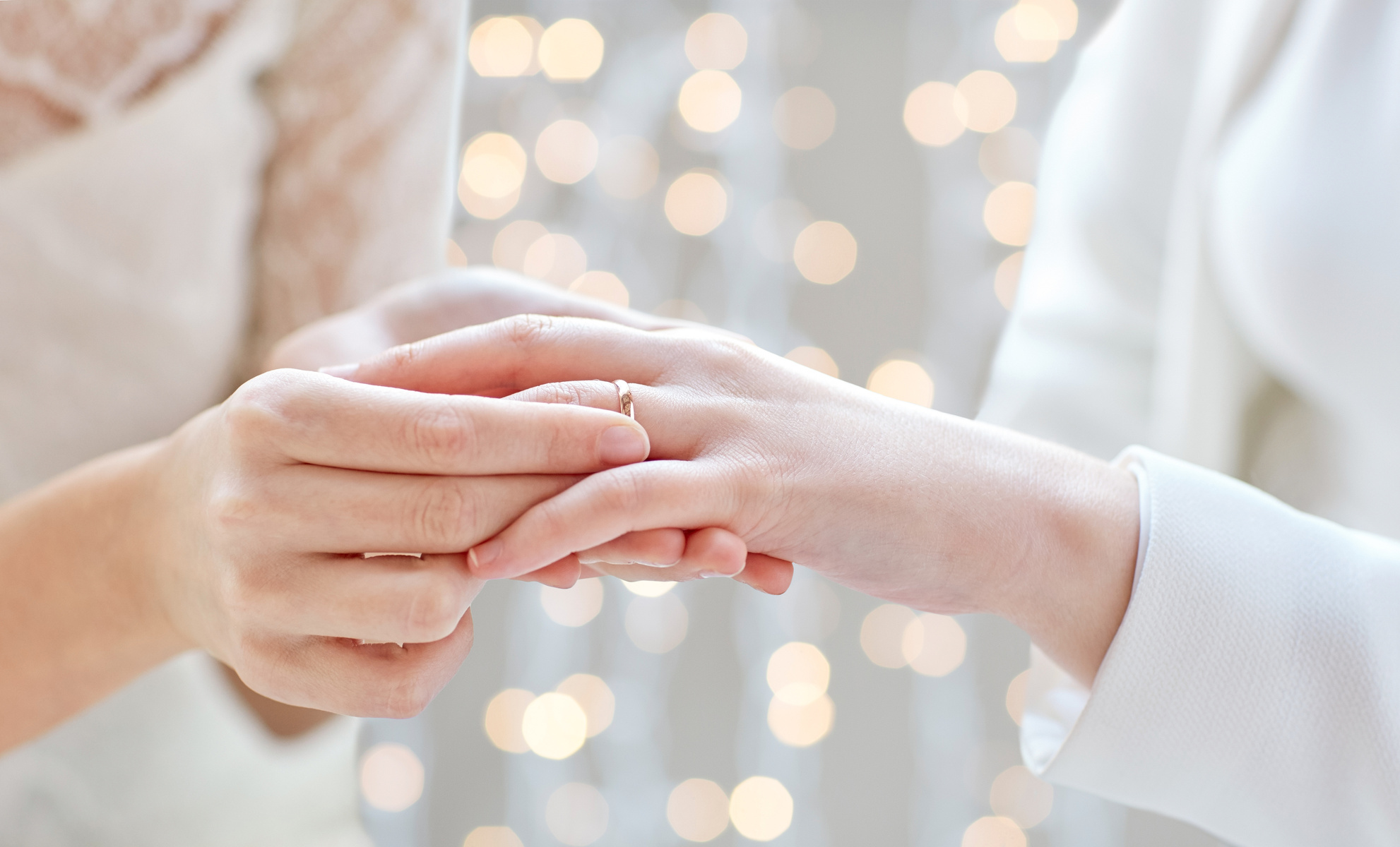 Lesbian Couple Hands with Wedding Ring